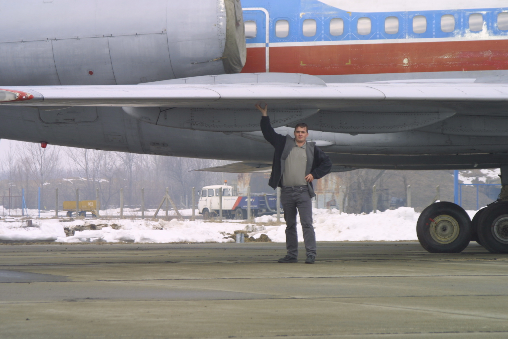 Kai-jens Meyer standing beneath the wing of Ural Airlines Tu-154B-2 RA-85459 at Debrecen